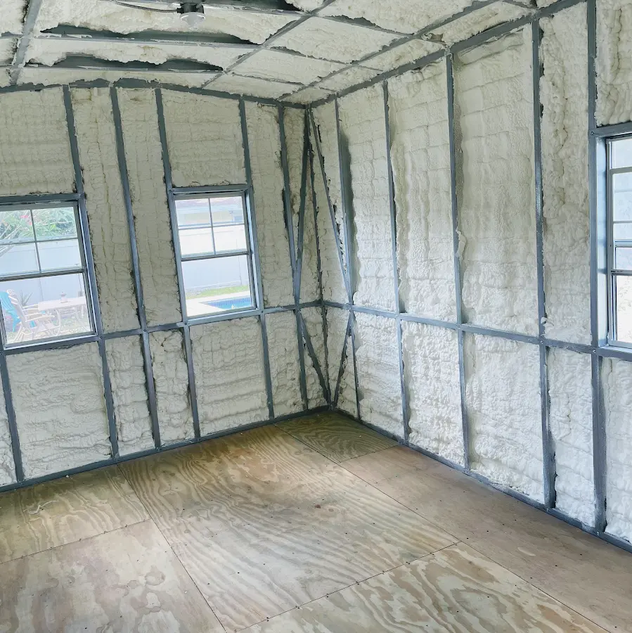 Closed-cell spray foam insulation applied to wall cavities in a residential project in Schodack